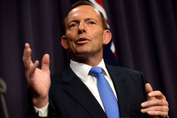Australia PM defends treatment of migrants held on boat