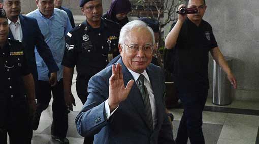 Malaysia court hits former PM Najib with money laundering charges