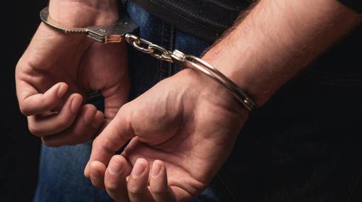 Twenty-one year old arrested with live grenade and swords