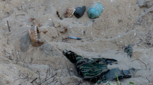 Bone fragments & parts of LTTE uniforms found at Vellamullivaikal