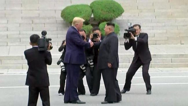 Trump and Kim Jong-un in historic handshake at DMZ