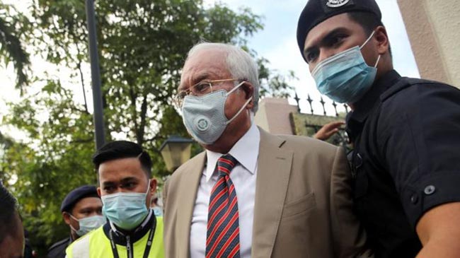 Malaysian ex-PM Najib Razak gets 12-year jail term in 1MDB corruption trial