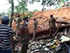 One dead, another critical after wall collapses on house