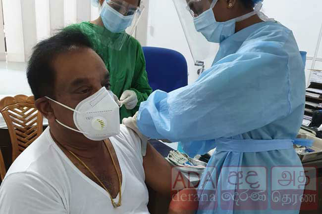 C. B. Ratnayake receives COVID-19 vaccine