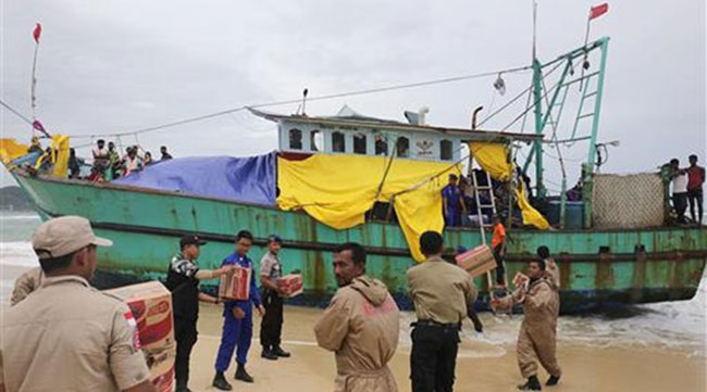 Sri Lankan migrants in Indonesia boat stand-off brought ashore