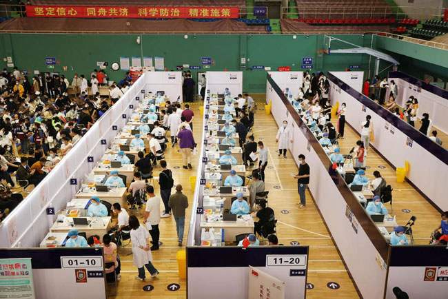 Chinas daily COVID-19 vaccine doses hit record 20 million