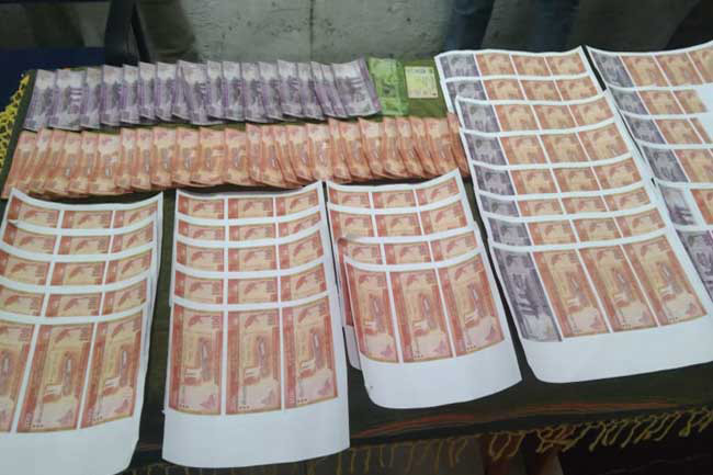 Two arrested for using and printing counterfeit money