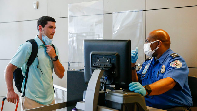 US to ease travel restrictions on fully vaccinated foreign visitors