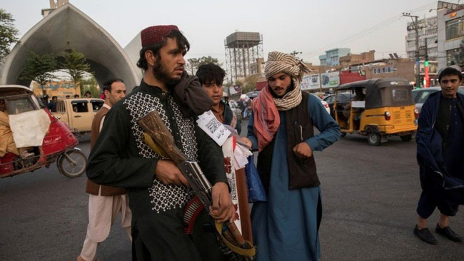 Taliban hang bodies as warning in Afghan city, say reports