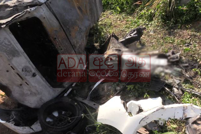 One dead as car bursts into flames after colliding with train