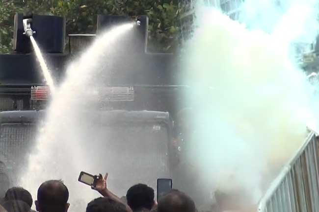 Police fire tear gas at protesters near parliament entry road