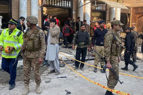 Death toll in Peshawar bombing climbs to 34 as Pakistan Taliban commander claims responsibility