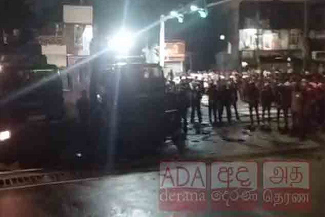 Police fire tear gas to disperse protesters near Kelaniya Uni.