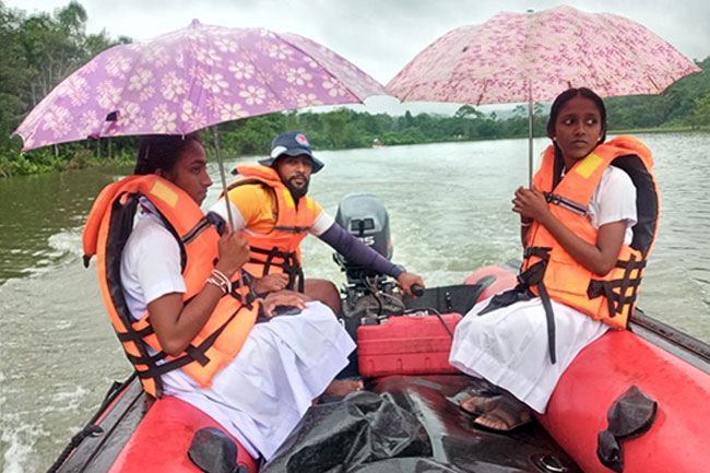 Navy teams assist flood victims...
