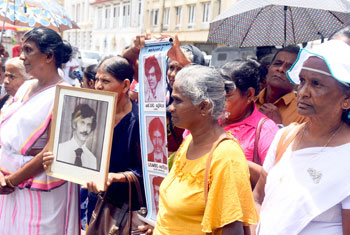 Relatives of missing persons protest…