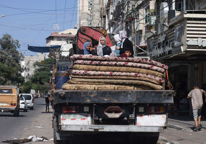 Israel announces 6-hour window for Gazans fleeing south, as troops gather near border