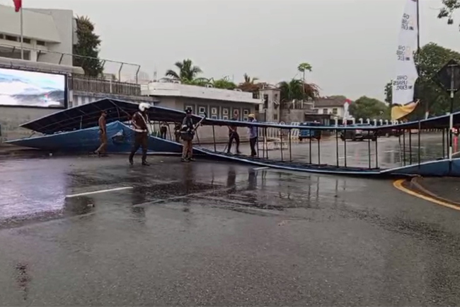 Traffic disrupted near BMICH as large signboard falls across road 