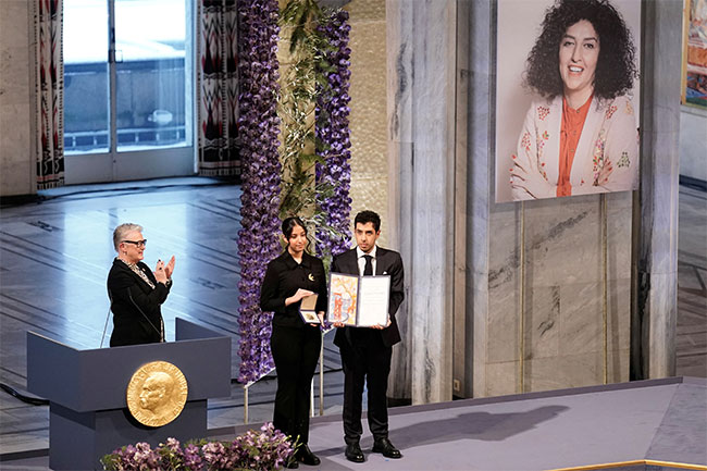 Children of imprisoned Iranian activist Narges Mohammadi accept her Nobel Peace Prize