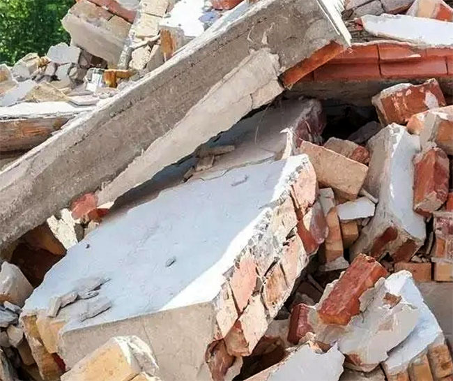 Woman dies after wall collapses at house, two including infant injured