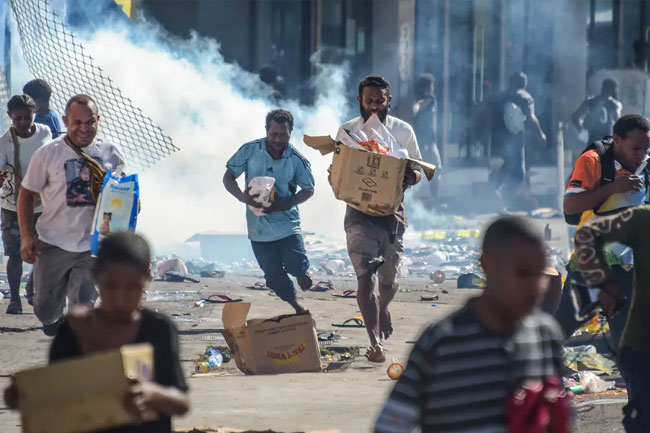 Papua New Guinea capital hit by arson, looting as police strike over missing pay