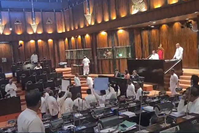 Parliament descends into chaos over arrest of civilians at Hindu temple