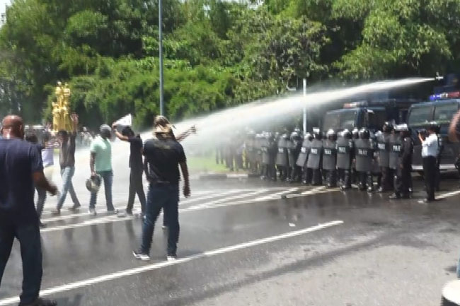 Police fire water cannons at protesting university non-academic staff