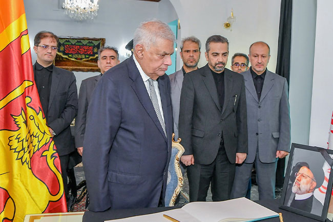 President Ranil conveys condolences at Iranian Embassy on President Raisis passing