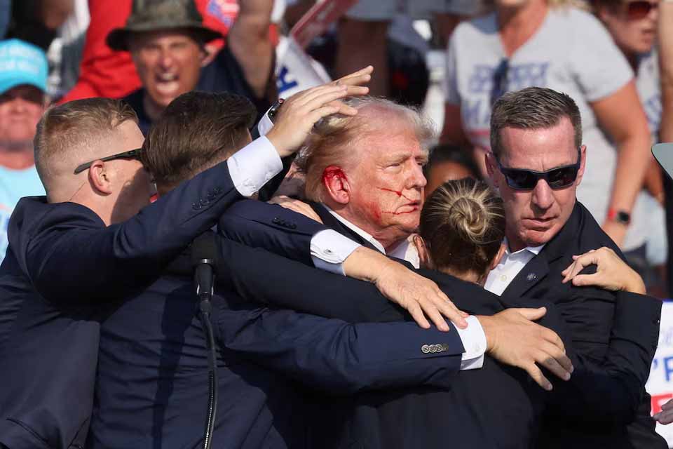 Trump shot in right ear at rally, source says shooter dead