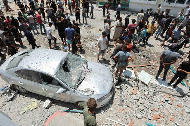 Israeli airstrike hits school sheltering people in Gaza, killing at least 30
