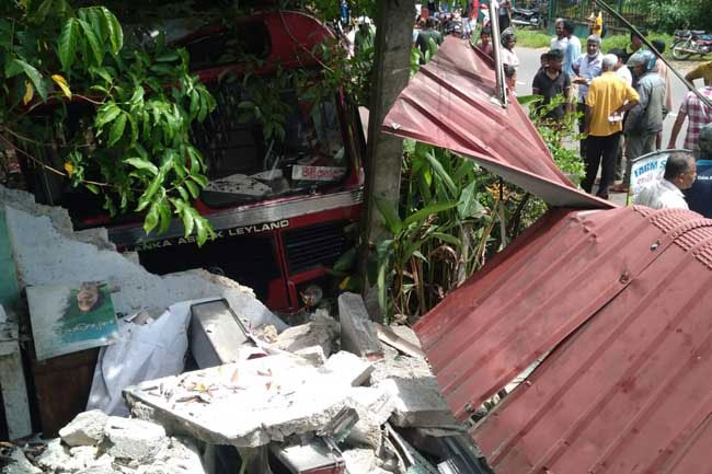 Two killed after bus veers off road and crashes into shop 