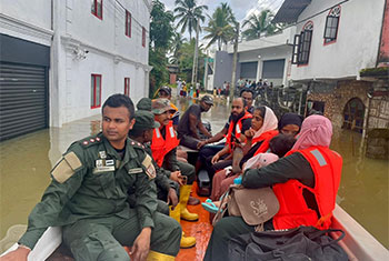 Troops assist flood victims...