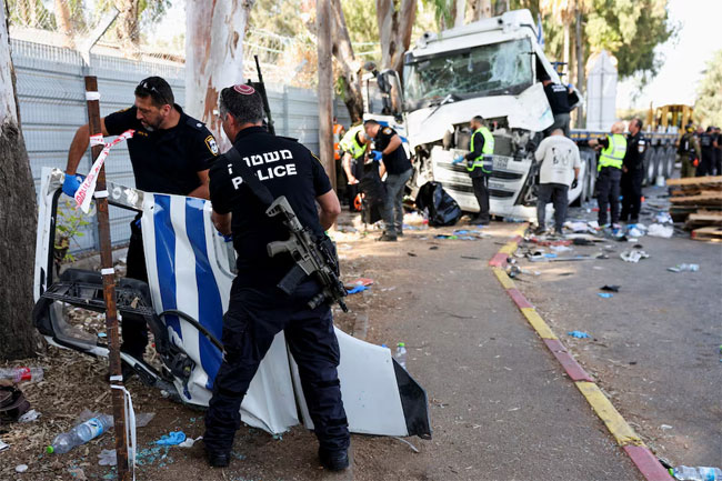 One killed, dozens injured in truck ramming at Israeli bus stop