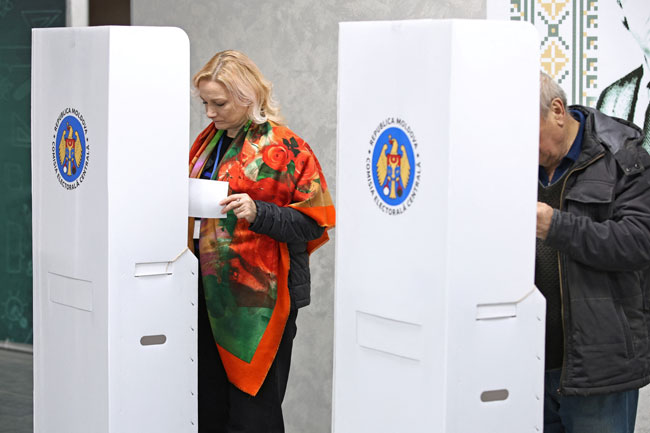 Moldovans vote in presidential runoff amid fears of meddling