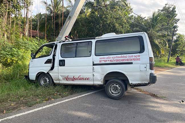 Driver injured as hospital ambulance collides with electric pole