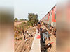 Rail accident kills 12 in western India after passengers jump onto tracks over fire alert