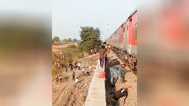 Rail accident kills 12 in western India after passengers jump onto tracks over fire alert