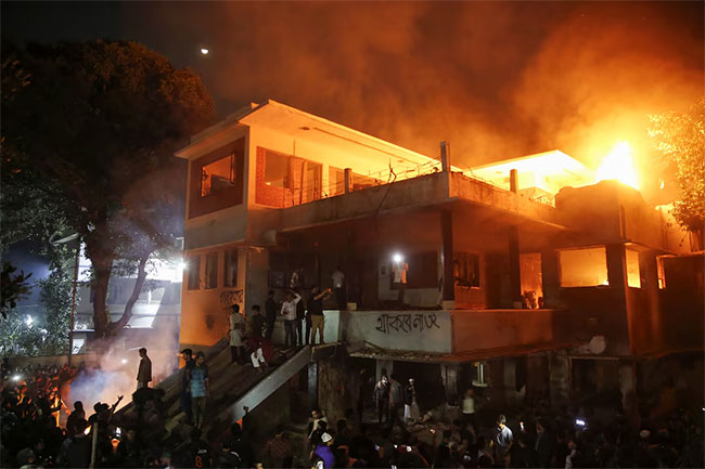 Bangladesh protesters torch ousted PM Sheikh Hasinas fathers home