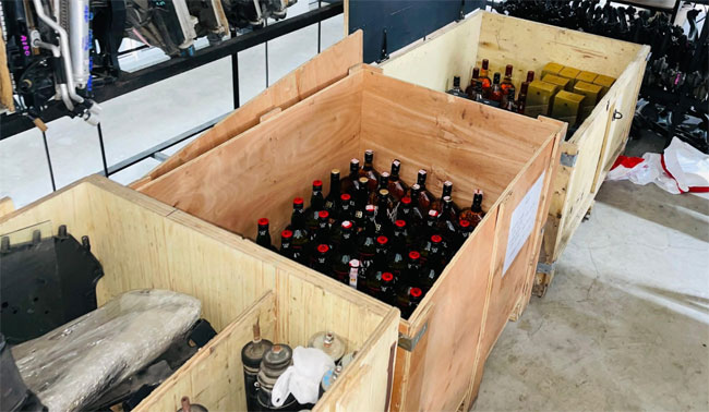 Foreign liquor bottles worth nearly Rs. 10 mln seized from vehicle spare parts shop