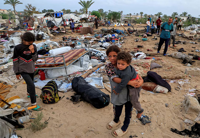 Israel airstrikes kill at least 130 in Gaza as negotiators seek ceasefire