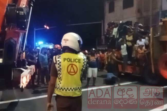 One critically injured after container truck overturns onto three-wheeler