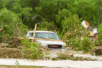 Death toll in Texas floods rises to at least 27 as search continues for many missing, officials say