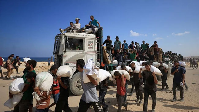 Israeli forces kill 67 Palestinians seeking aid in northern Gaza, Hamas-run ministry says