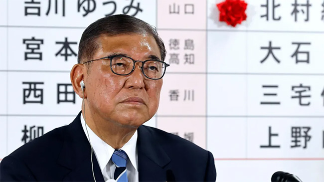 Japans PM vows to stay on despite bruising election loss