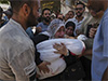 Officials say 85 Palestinians seeking aid are killed in Gaza as Israel widens evacuation orders