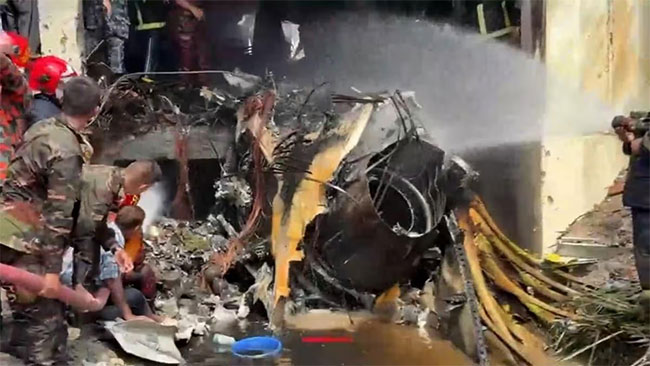 At least 19 killed as Bangladesh air force plane crashes into college campus
