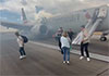 Passengers exit American Airlines flight via emergency slide after aborted takeoff