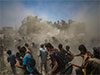 Hamas says it will allow aid for hostages if Israel halts airstrikes, opens permanent humanitarian corridors