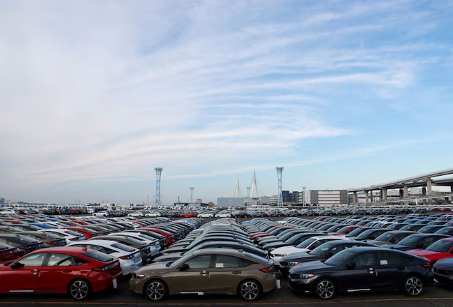 Trump signs order to cut tariffs on Japanese cars to 15%