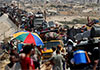Israel opens new route out of Gaza City, death toll passes 65,000