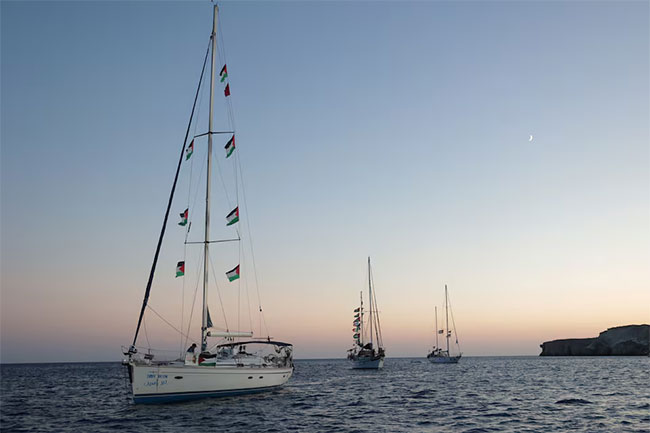 Gaza flotilla says Israeli vessels intimidated its boats as it nears blockade